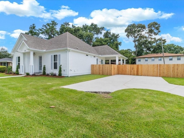 view of side of home featuring a lawn