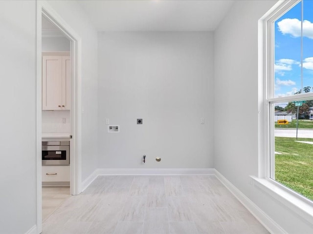 washroom featuring hookup for an electric dryer, gas dryer hookup, and washer hookup