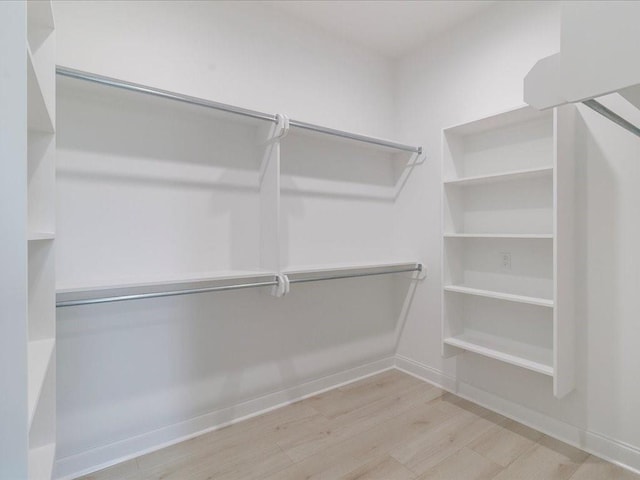 walk in closet featuring light hardwood / wood-style floors