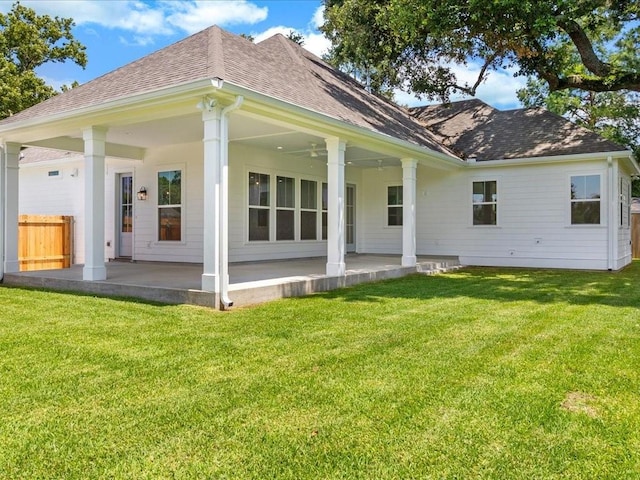 rear view of house with a lawn, ceiling fan, and a patio