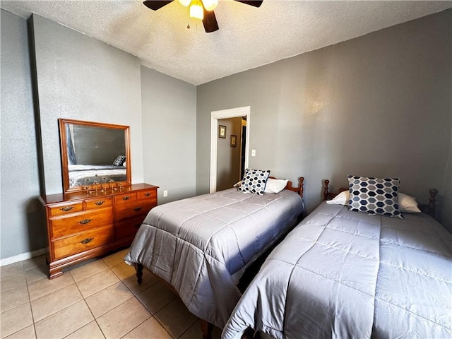 tiled bedroom with ceiling fan, a textured ceiling, and vaulted ceiling