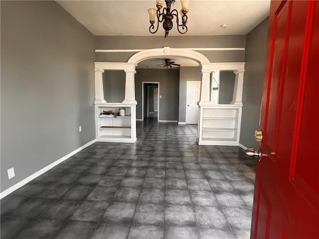 entrance foyer with a textured ceiling and a notable chandelier