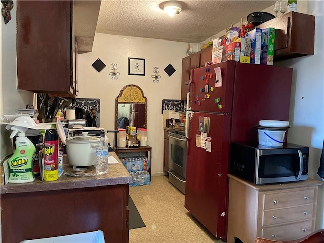 kitchen with range and a textured ceiling