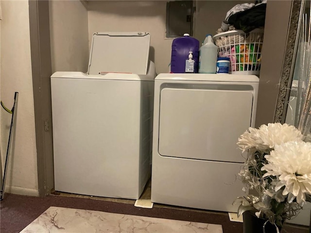 clothes washing area with washer and dryer and carpet flooring