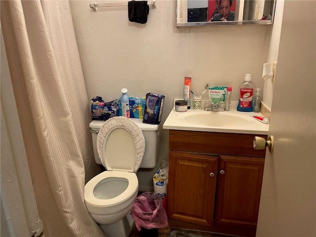 bathroom with toilet and vanity