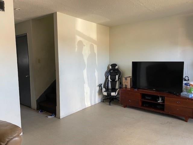 interior space featuring a textured ceiling