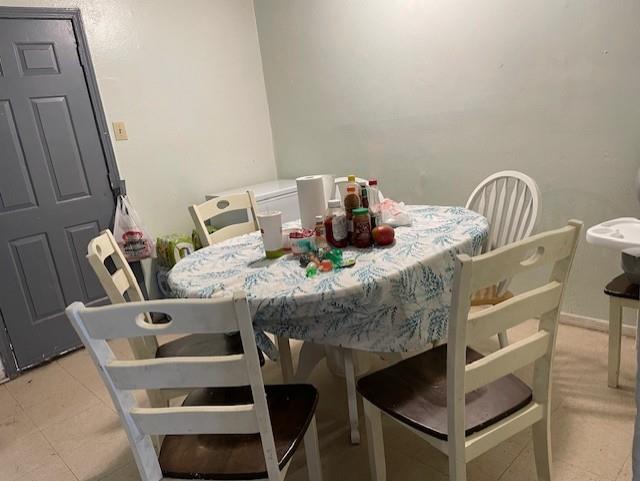 dining area featuring light tile patterned floors