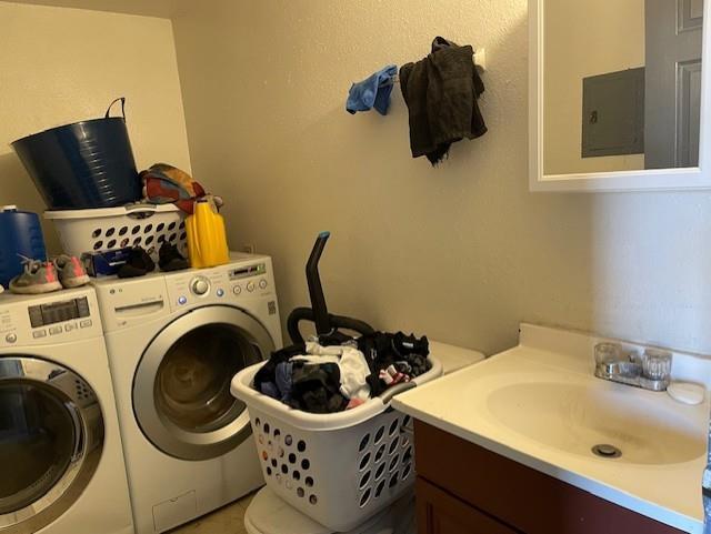 washroom featuring washer and dryer and sink