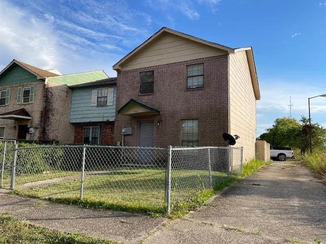 front facade with a front yard