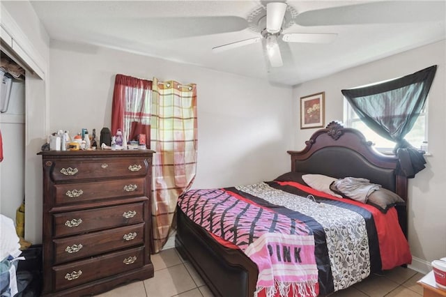 tiled bedroom with ceiling fan