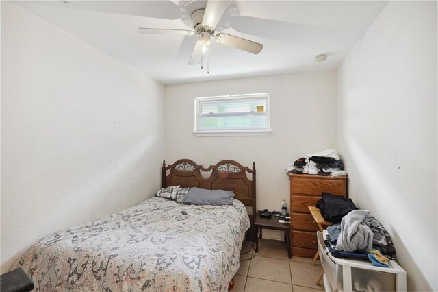 bedroom with light tile patterned floors and ceiling fan