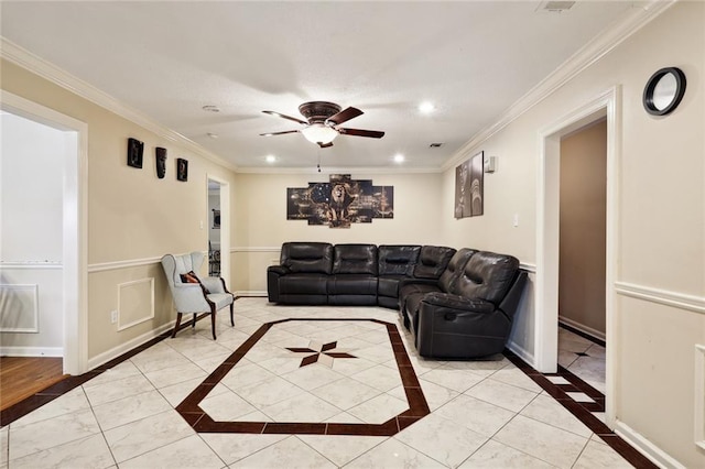 living room with ceiling fan and ornamental molding