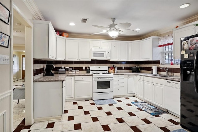 kitchen with white appliances, white cabinets, crown molding, sink, and ceiling fan