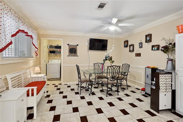 dining room with washer / dryer, ceiling fan, and crown molding