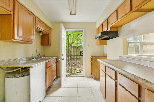 kitchen featuring sink and light tile patterned floors