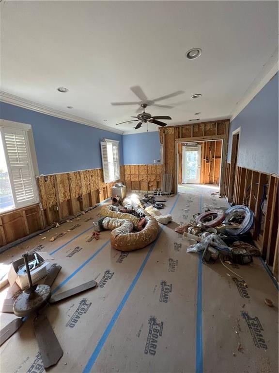 misc room featuring a healthy amount of sunlight, ceiling fan, and crown molding