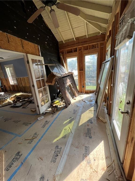 unfurnished sunroom featuring ceiling fan and lofted ceiling