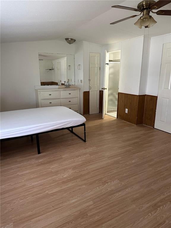 bedroom featuring ceiling fan and hardwood / wood-style floors