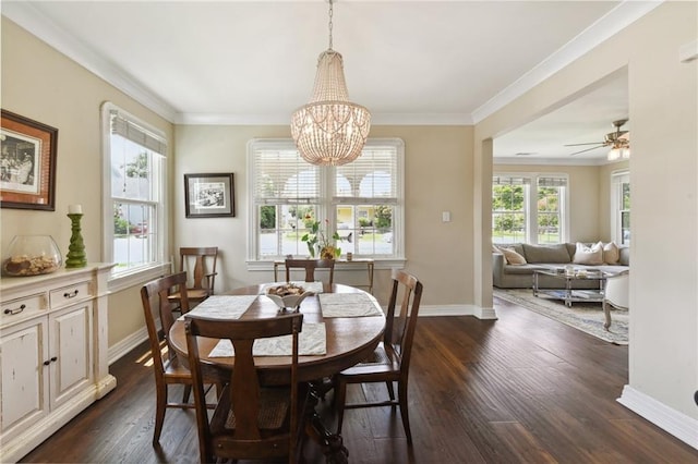 dining area with crown molding, a healthy amount of sunlight, dark hardwood / wood-style floors, and a chandelier