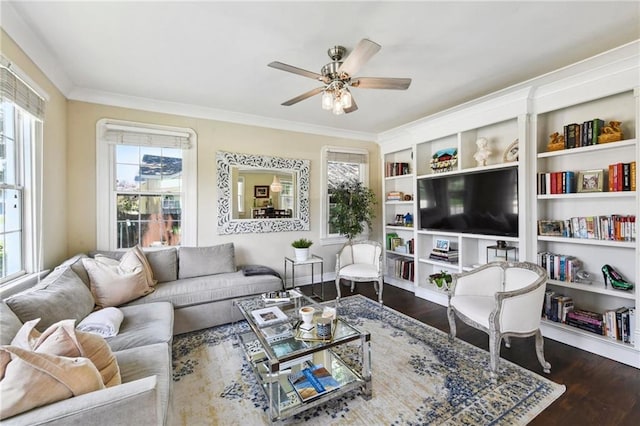 living room with crown molding, ceiling fan, and dark hardwood / wood-style flooring