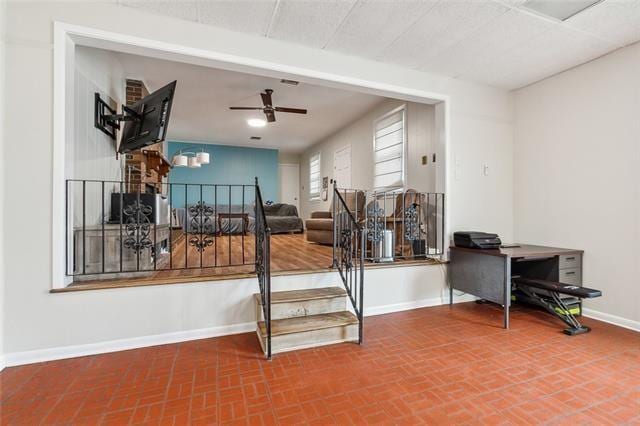 stairway with ceiling fan