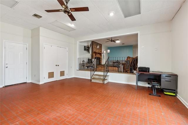 interior space featuring ceiling fan