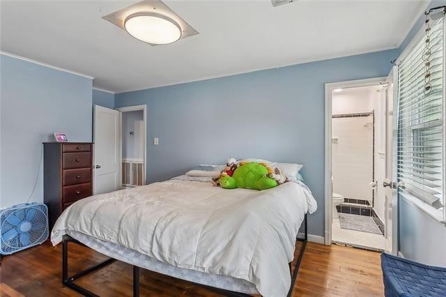 bedroom with hardwood / wood-style floors