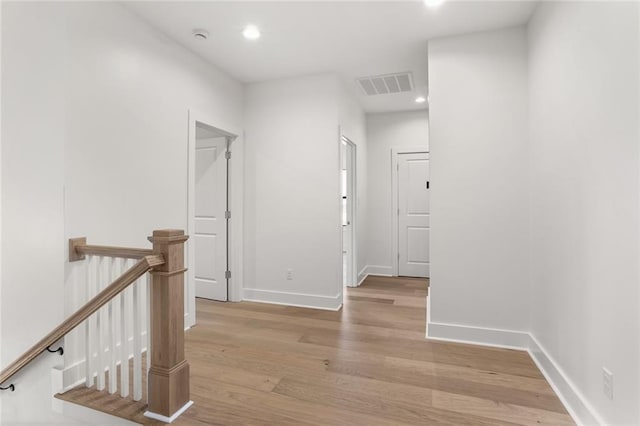 hallway with light wood-type flooring