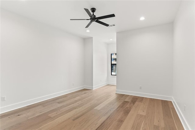 spare room with ceiling fan and light hardwood / wood-style floors