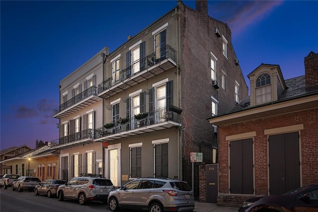 view of outdoor building at dusk