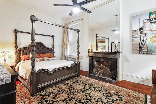 bedroom with dark wood-type flooring and ceiling fan