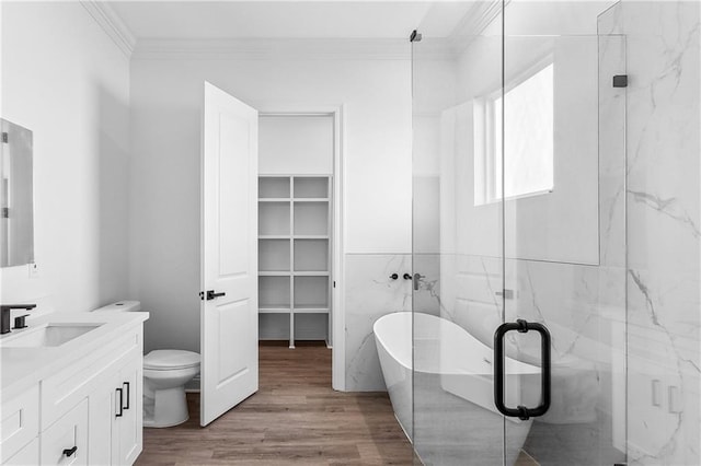 718 W Dr, Westwego, LA 70094 - bathroom with ornamental molding, vanity, a freestanding tub, wood finished floors, and a marble finish shower