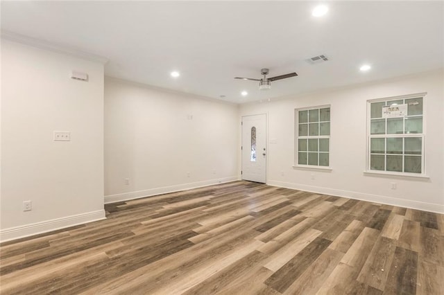 spare room featuring hardwood / wood-style flooring and ceiling fan