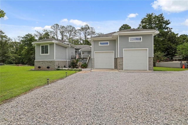 view of front of property with a garage and a front yard