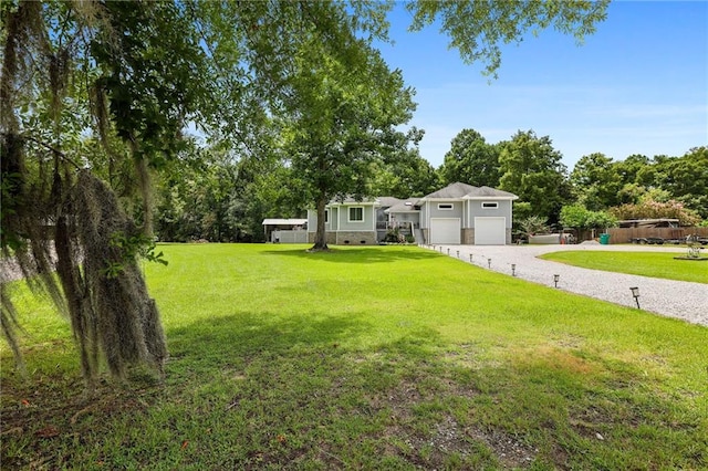 view of yard featuring a garage