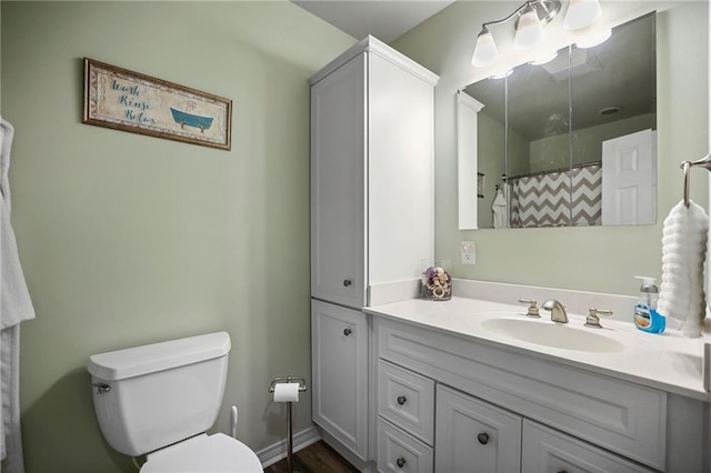 31753 River Pines Dr, Springfield, LA 70462 - bathroom with a shower with shower curtain, toilet, and vanity