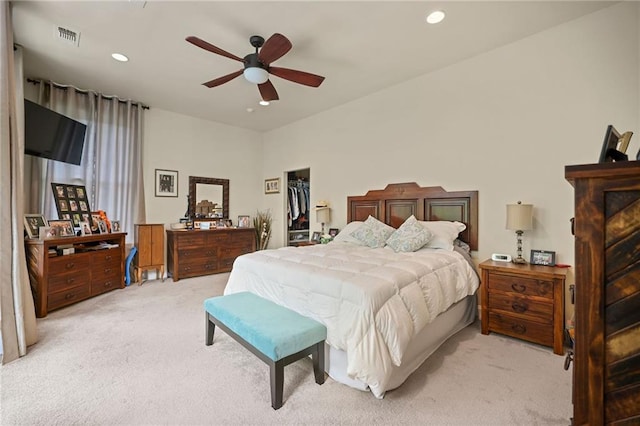 bedroom featuring light colored carpet and ceiling fan