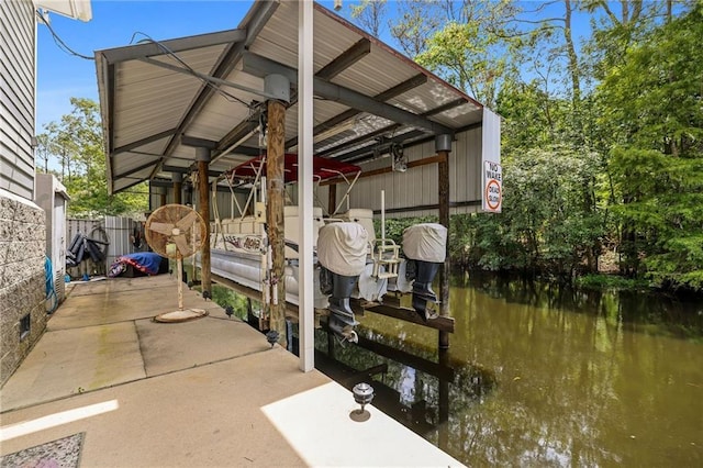 31753 River Pines Dr, Springfield, LA 70462 - exterior space featuring fence, a boat dock, boat lift, and a water view
