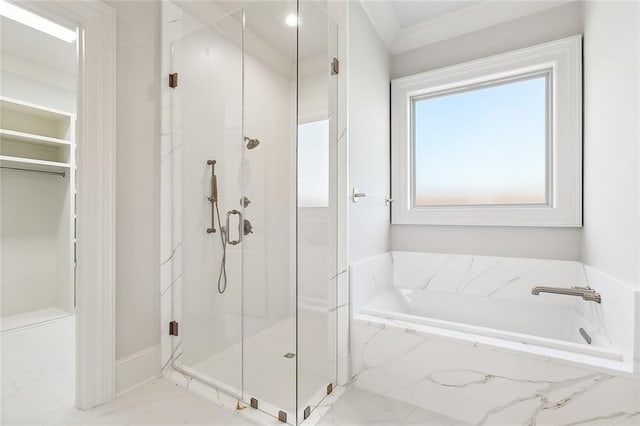 bathroom with separate shower and tub and crown molding