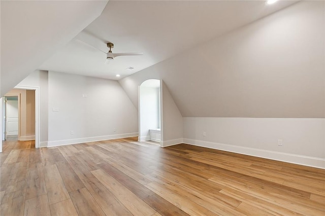 bonus room featuring light wood-type flooring, ceiling fan, and lofted ceiling