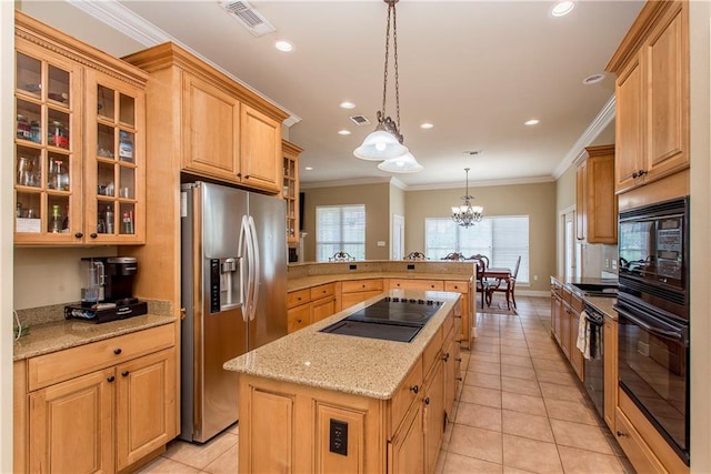 kitchen featuring black appliances, pendant lighting, light tile patterned floors, a kitchen island, and a chandelier