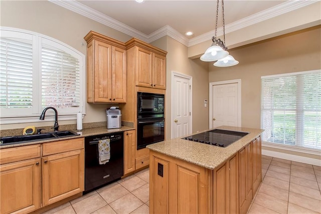 kitchen featuring black appliances, sink, pendant lighting, light tile patterned floors, and a center island