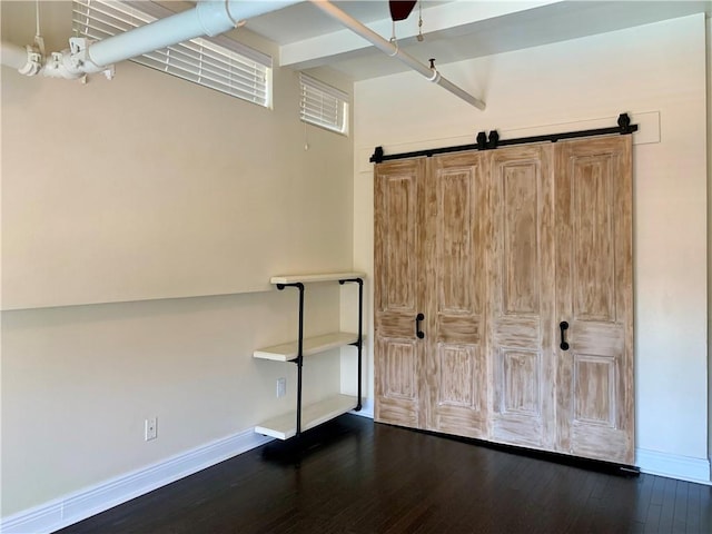 unfurnished bedroom featuring dark hardwood / wood-style flooring