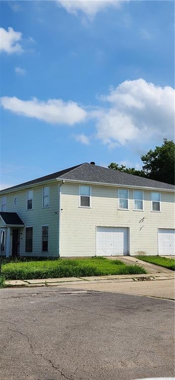 view of property exterior featuring a garage