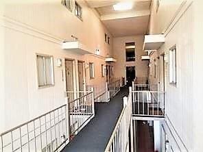 3805 Houma Blvd Unit C201, Metairie, LA 70006 - corridor with an upstairs landing