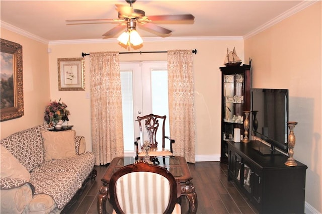 living room featuring dark wood-type flooring, ornamental molding, and ceiling fan