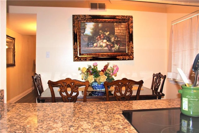3805 Houma Blvd Unit C201, Metairie, LA 70006 - dining room featuring crown molding and wood finished floors