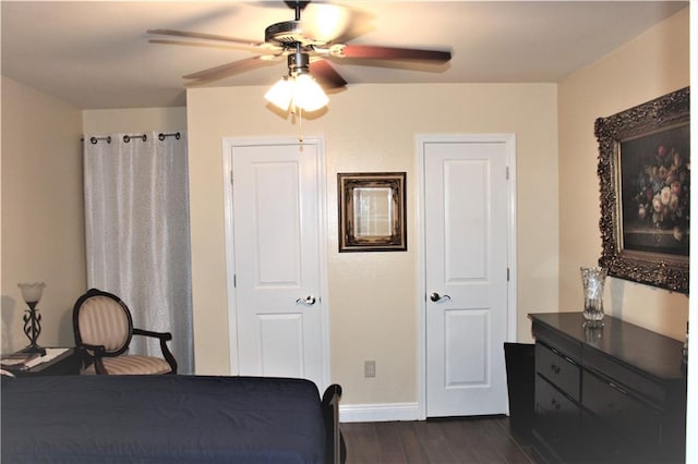 bedroom featuring dark hardwood / wood-style flooring and ceiling fan