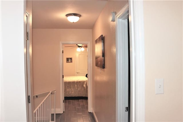 hallway with dark tile patterned floors