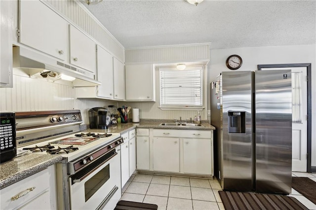 kitchen featuring white cabinets, white gas range oven, crown molding, a textured ceiling, and stainless steel refrigerator with ice dispenser